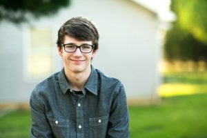 teen with glasses smiling Measures of Success for Mental Health
