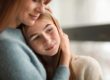 Mother embracing daughter explaining what are trauma triggers