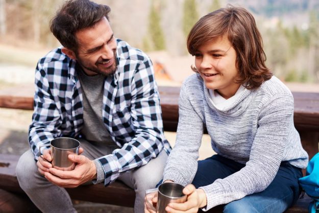 father and son discuss the benefits of treatment for boys