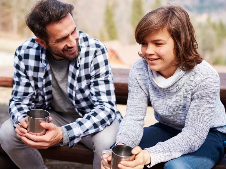 father and son discuss the benefits of treatment for boys