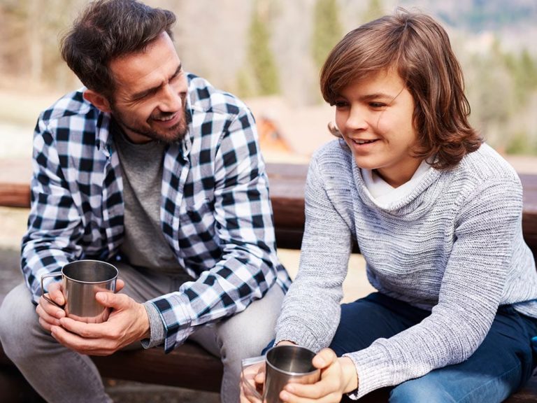 father and son discuss the benefits of treatment for boys