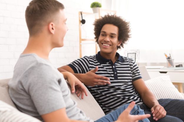 teen on couch talking with a counselor about experiential therapy techniques
