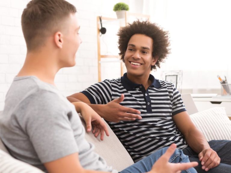 teen on couch talking with a counselor about experiential therapy techniques