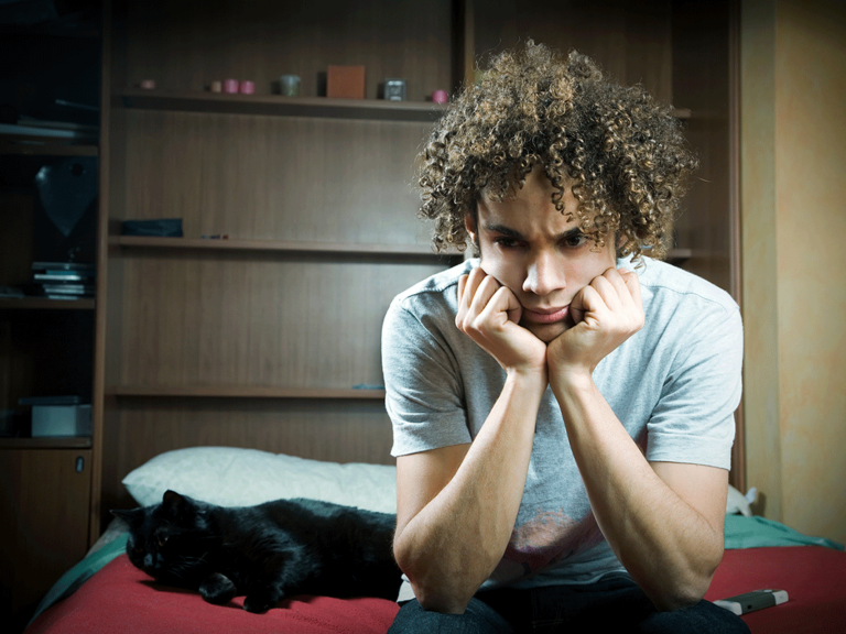 teenager with curly hair experiencing untreated anxiety