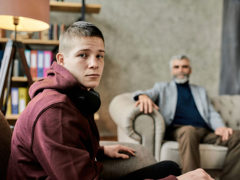 teen looks at the camera while learning about the effects of the pandemic in teens