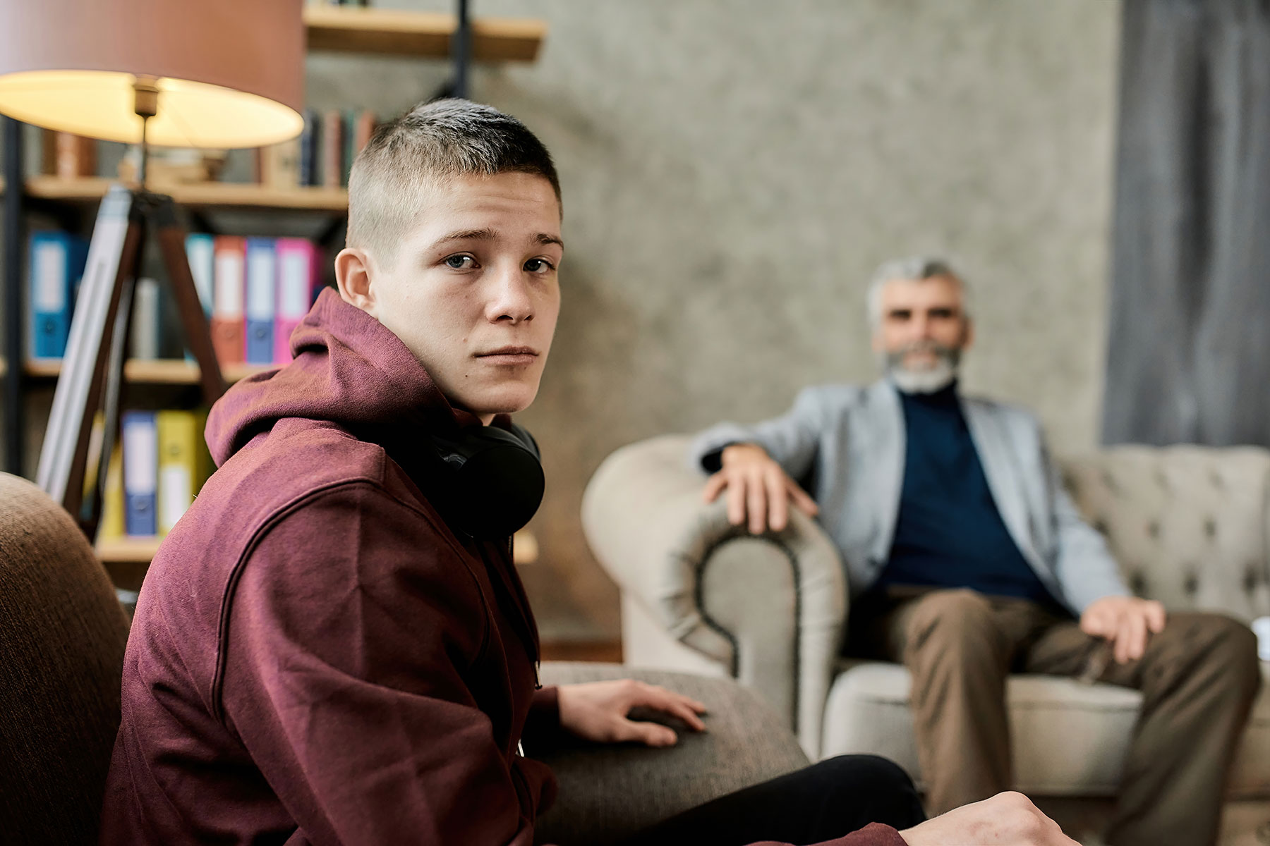 teen looks at the camera while learning about the effects of the pandemic in teens