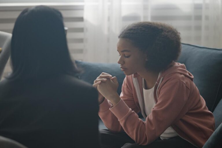 girl talks with therapist about if trigger warnings work