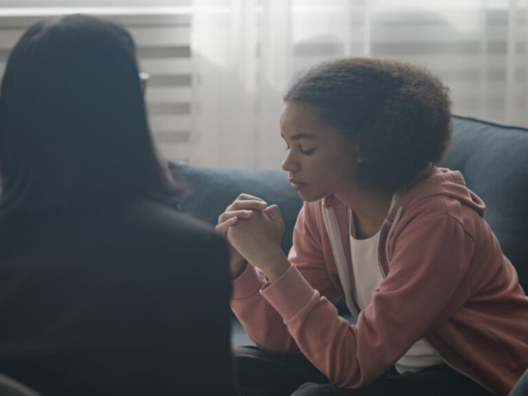 girl talks with therapist about if trigger warnings work