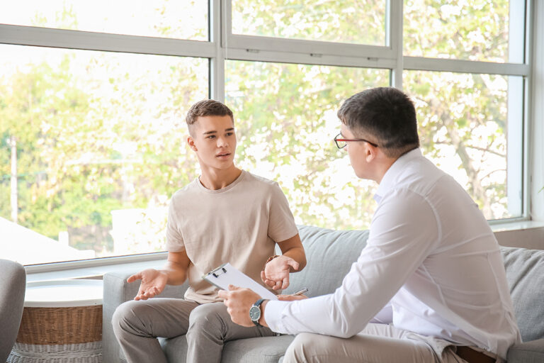 teen talks with therapist about levels of care for mental health