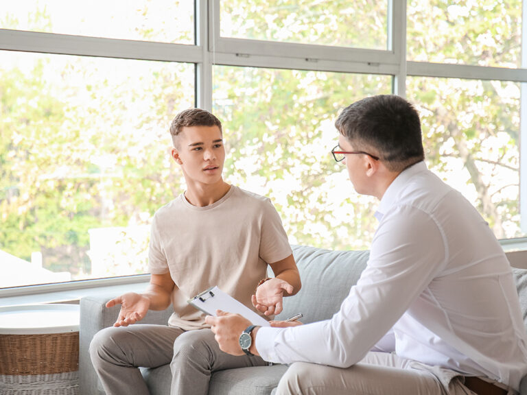 teen talks with therapist about levels of care for mental health