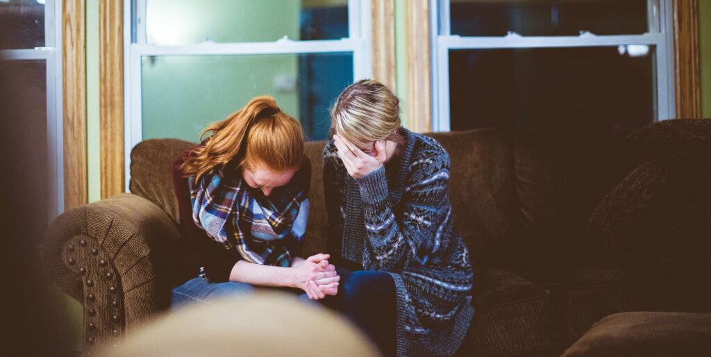 mother and daughter crying together