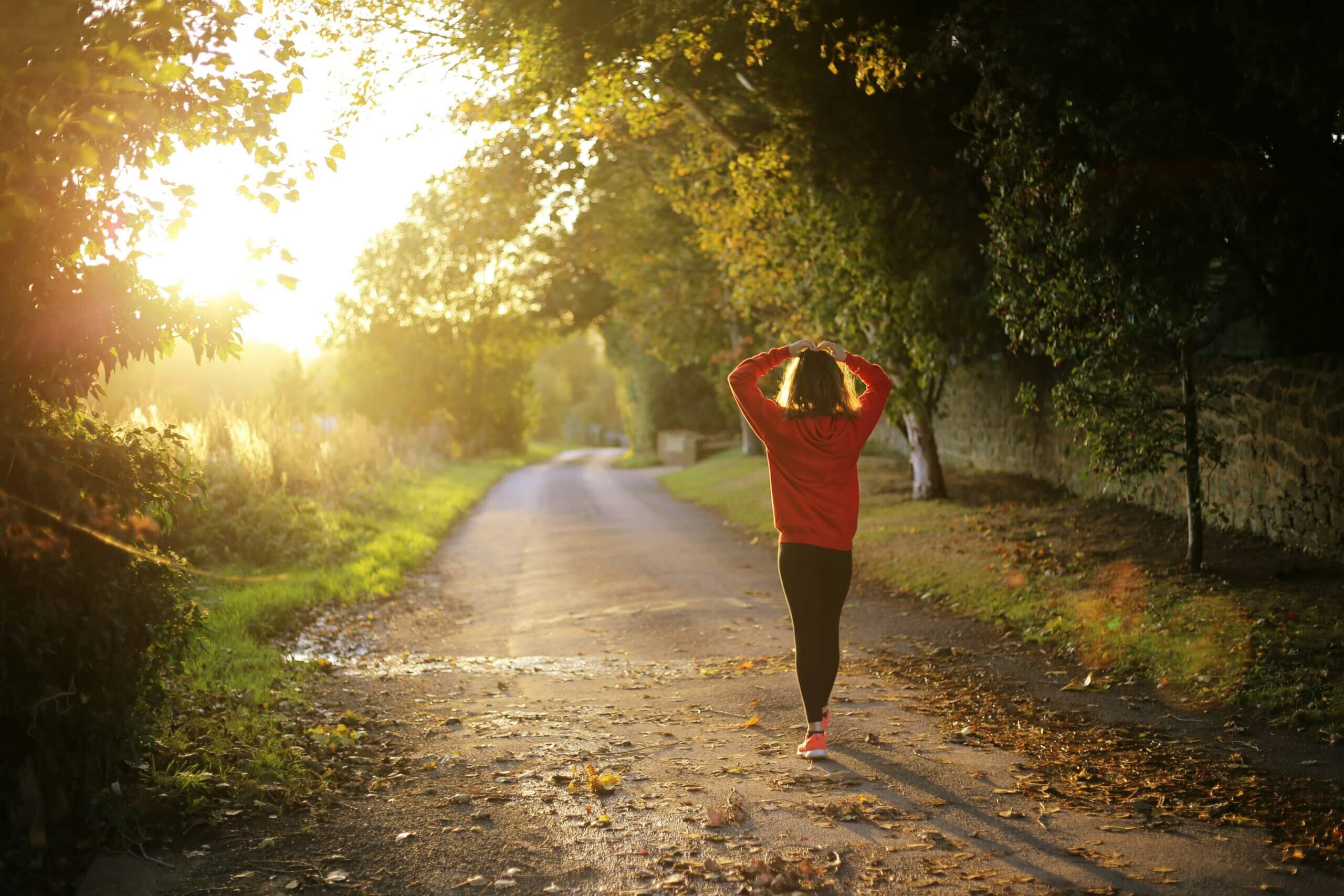 person walking on a road